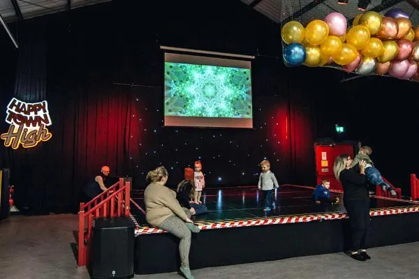 Children on the Happy Town stage