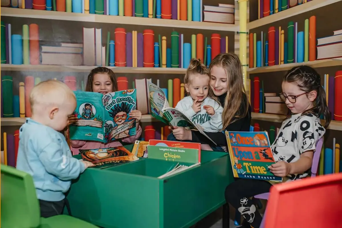 Children reading together in the Happy Town library
